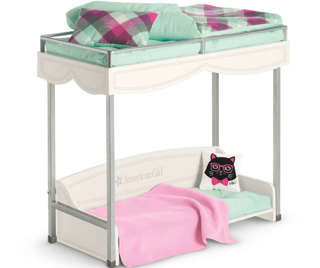 Doll sized bunk bed with mint colored bedding and cat pillow