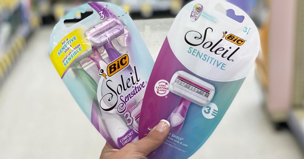 woman holding up two packages of BIC soleil sensitive disposable razors