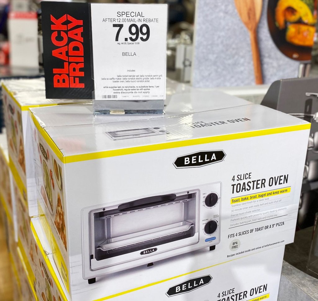stainless steel toaster oven in white and yellow box with $7.99 sale sign on top at Macy's