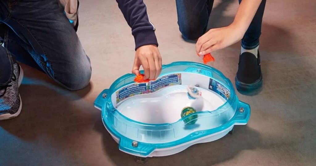 kids playing with Beyblade toys