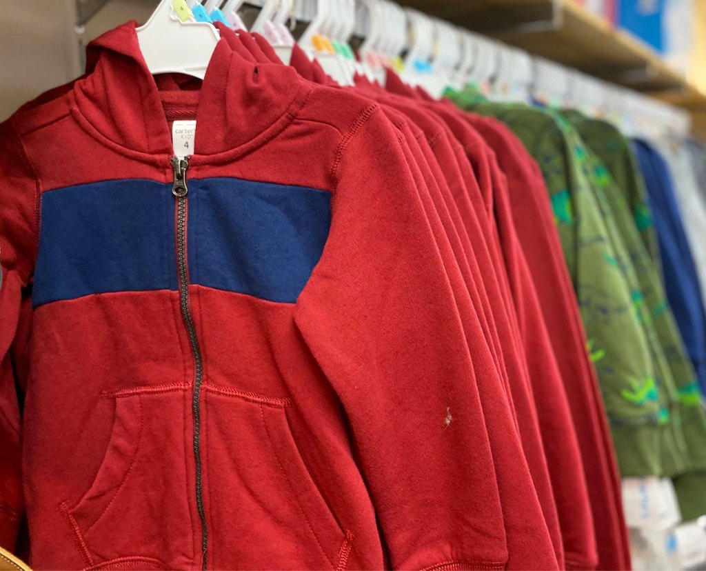 red and blue striped boys hoodies on white hangers on carter's store display