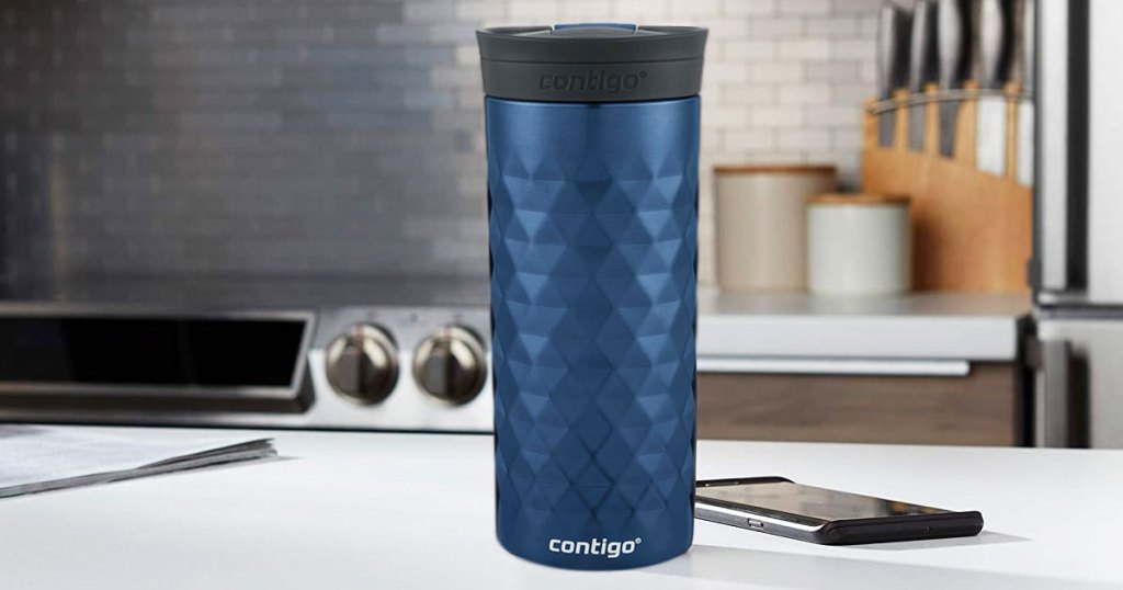 textured blue contigo travel coffee mug on kitchen counter next to smartphone