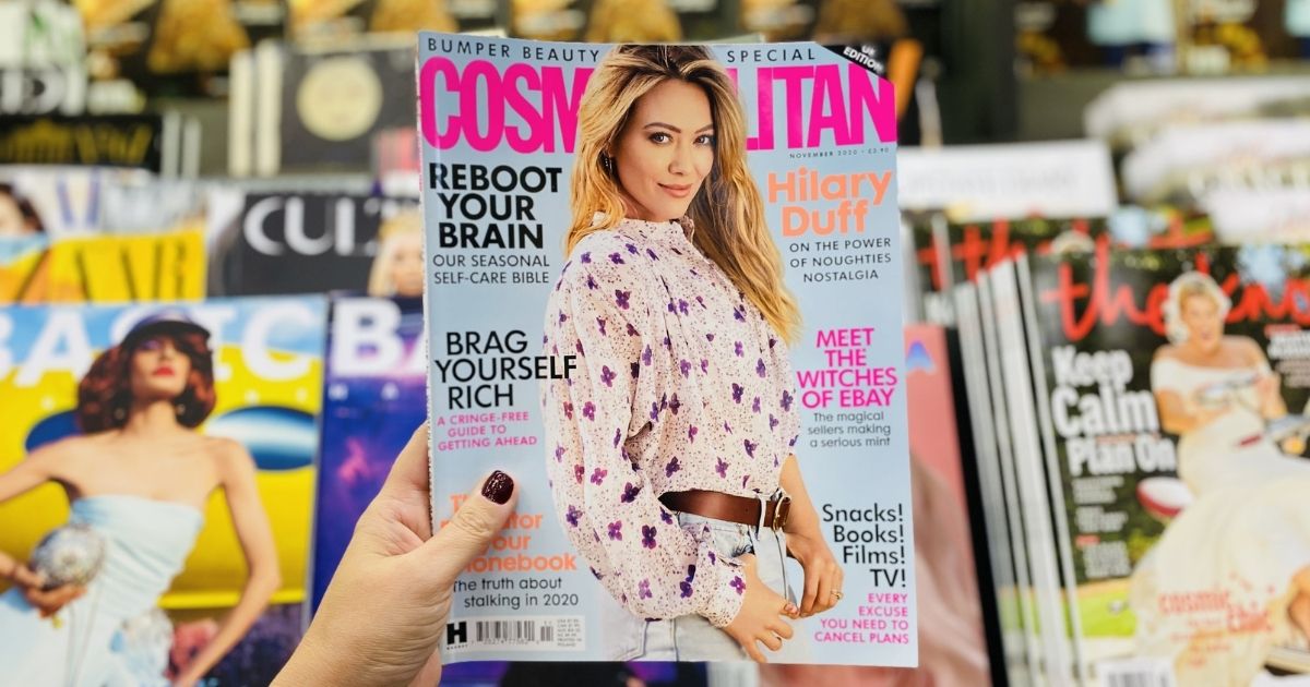 hand holding a Cosmopolitan Magazine
