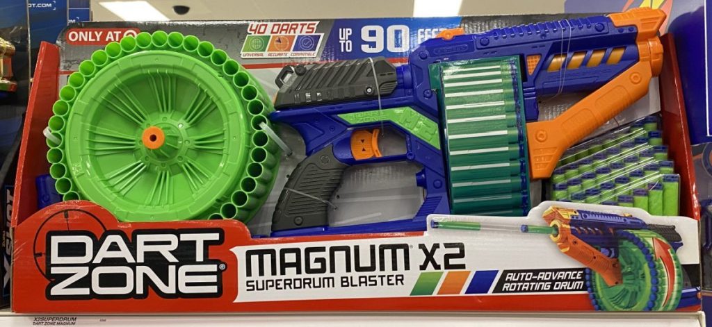green and blue toy blaster on store shelf