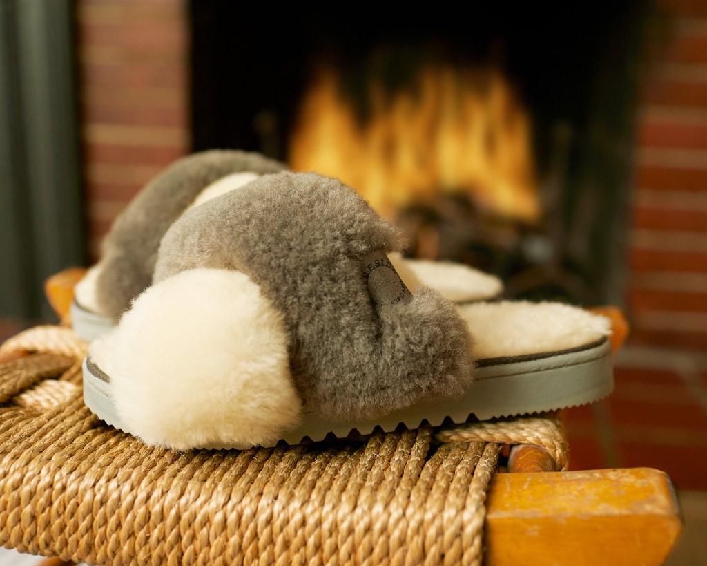 Dearfoams Slide slippers by a fireplace