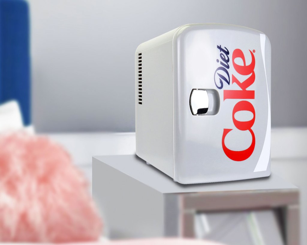 diet coke themed mini fridge on a nightstand