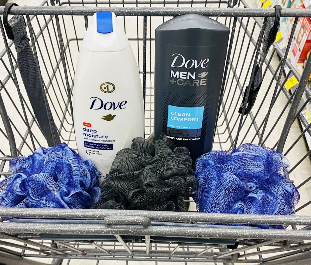 white bottle of dove body wash and grey bottle of dove men + care body wash in walgreens shopping cart with shower loofas in front of them