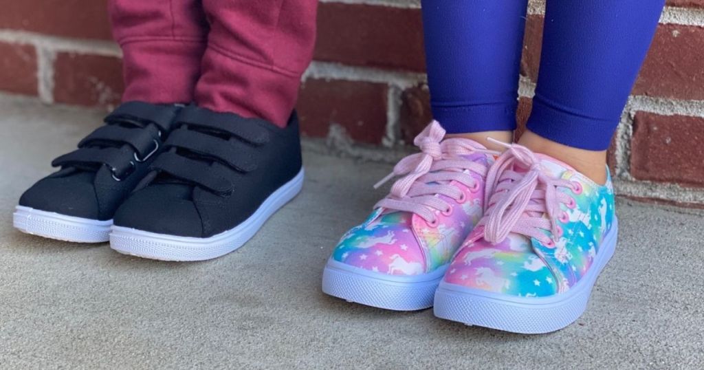 two kids wearing sneakers