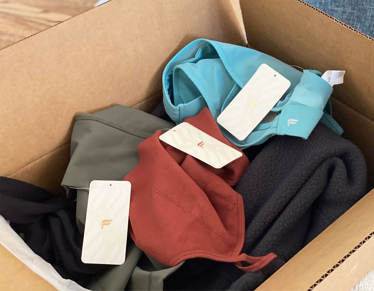 shipping box full of assorted women's apparel from Fabletics