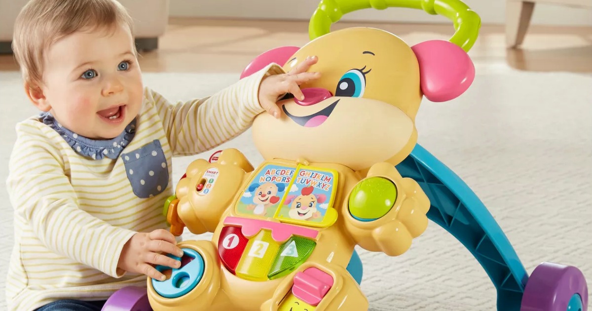 baby with fisher-price puppy walker