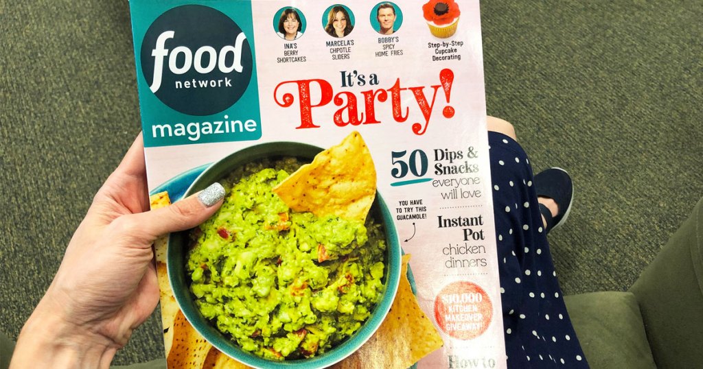 woman holding up a copy of food network magazine with bowl of guacamole on the cover