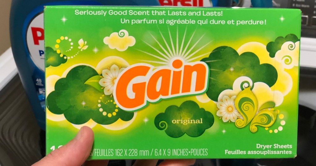 hand holding a box of gain fabric softener