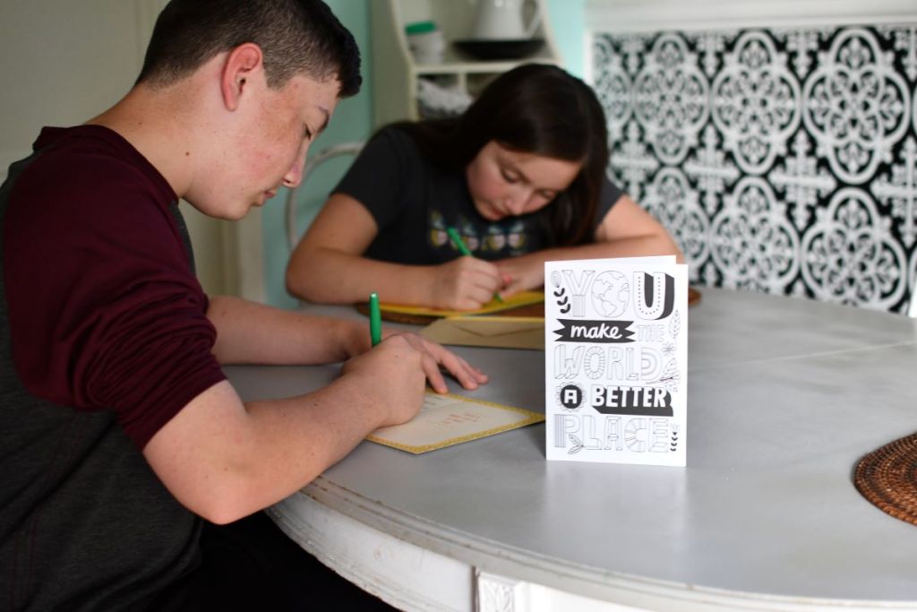 kids writing on thank you cards