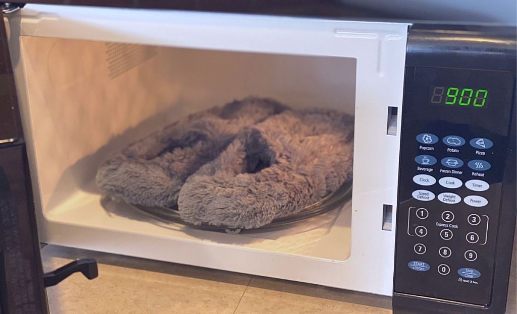 A pair of heated slippers in a microwave