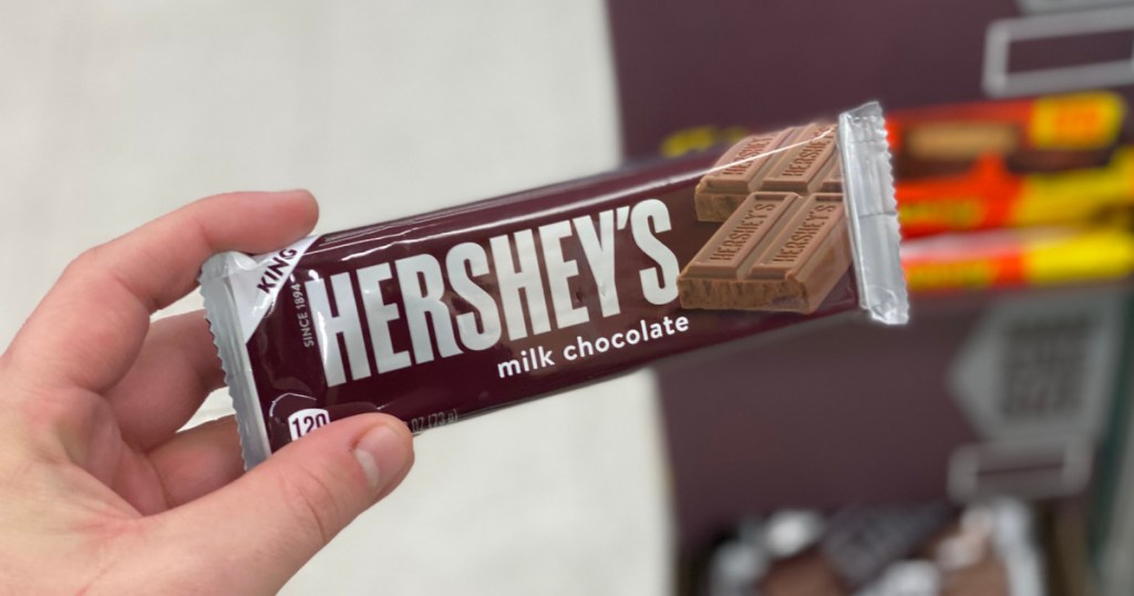 Hand holding hershey's candy bar