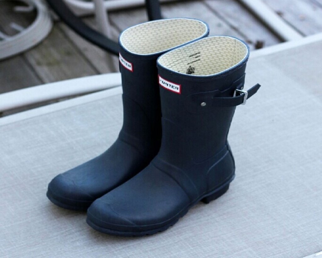 pair of navy blue short hunter rain boots outside