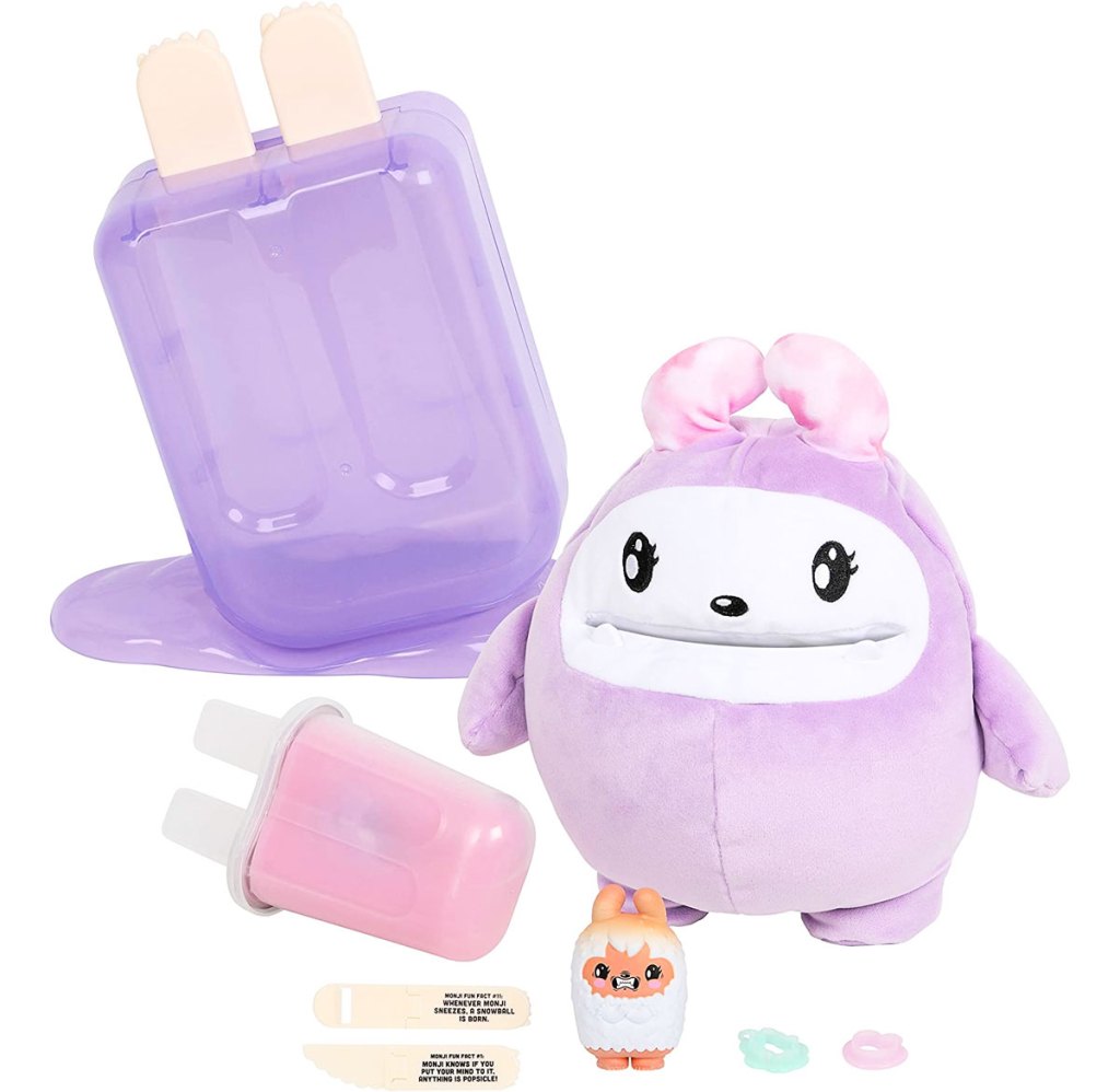 purple plastic popsicle toy with monster plush and mini toys and tools