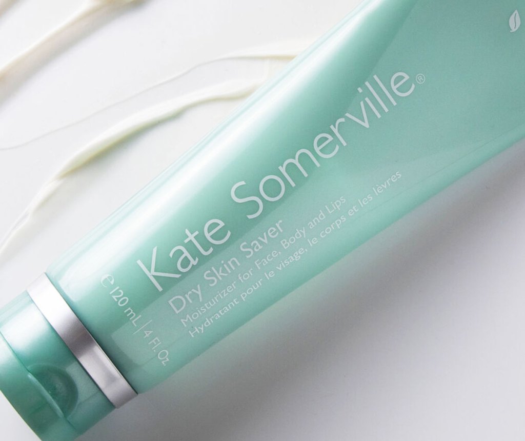 aqua colored tube of Kate Somerville moisturizer with cream smear in background