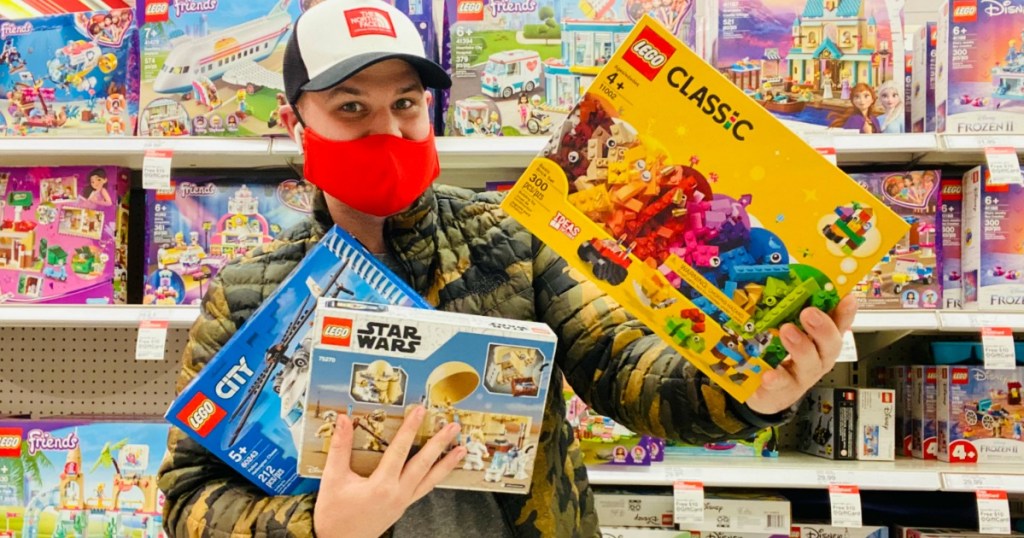 Man wearing bright red mask and shopping for LEGOs in Target