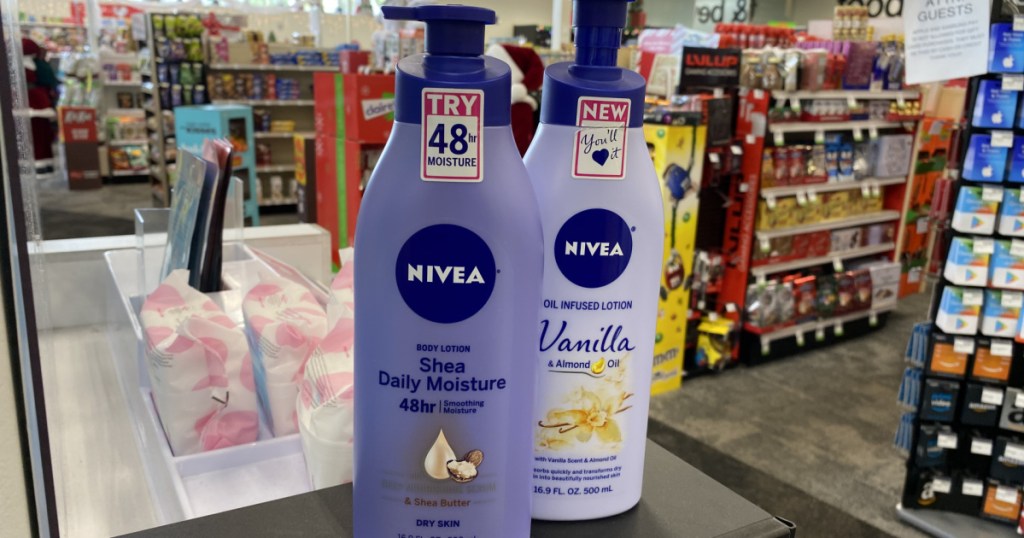 two bottles of body lotion on counter in store