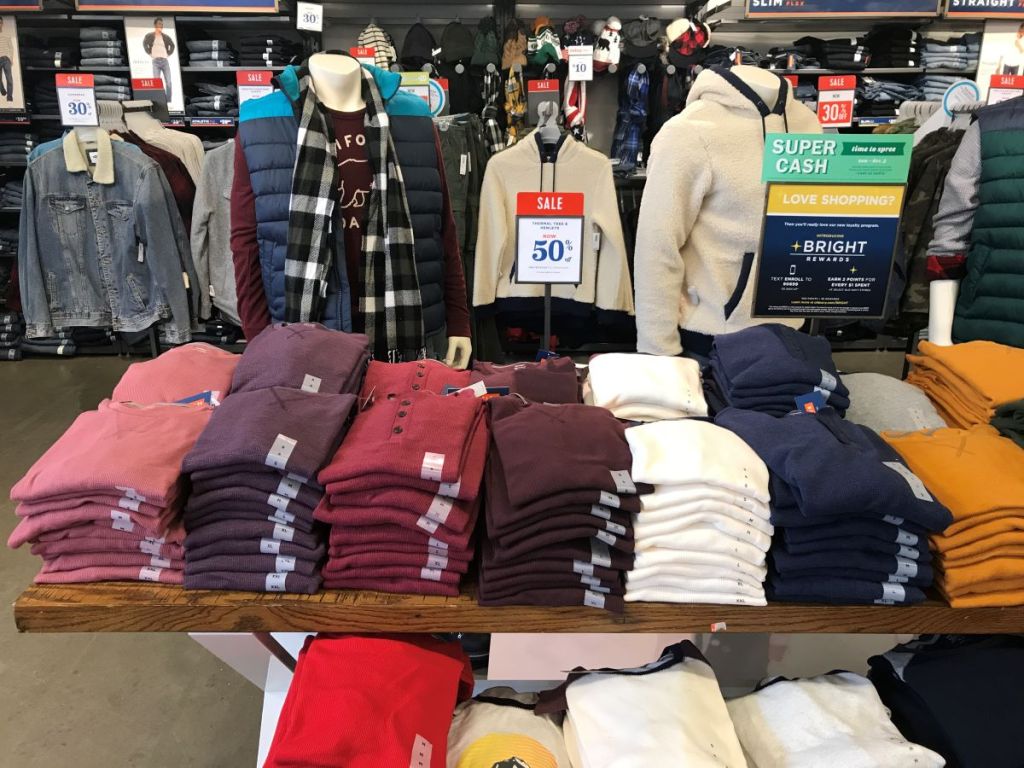 table with men's shirts on it at Old Navy