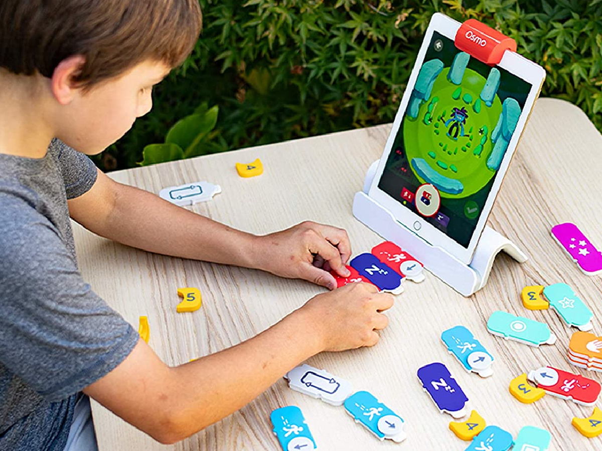 boy playing with Osmo Coding Starter Kit for iPad