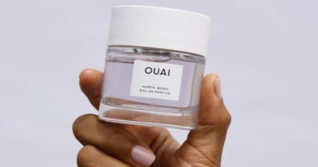 ouai north bondi eau dau de parfum fragrance held in a hand