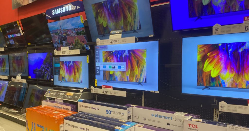 televisions on wall in store