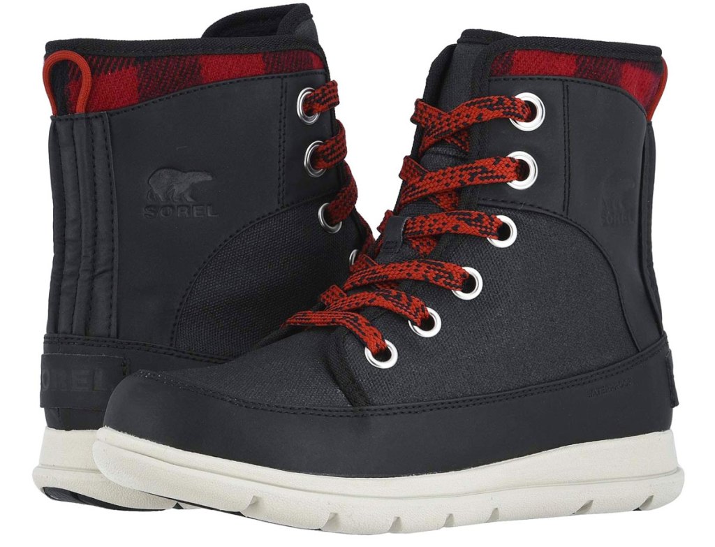 black pair of women's winter boots with red laces and white rubber soles