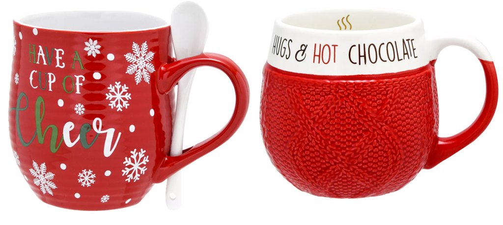 red coffee mug and stiring spoon that says "Have a cup of cheer" and a red sweater print mug that says "hugs & hot chocolate"