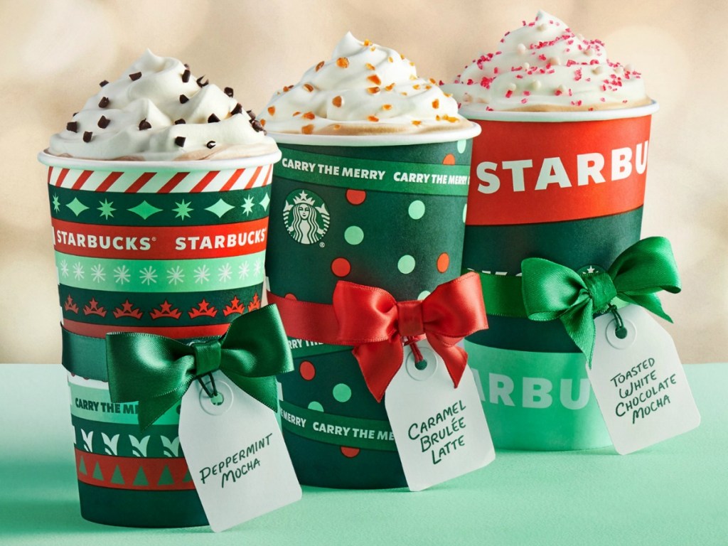 Starbucks Holiday Drinks on table with name tags and ribbons