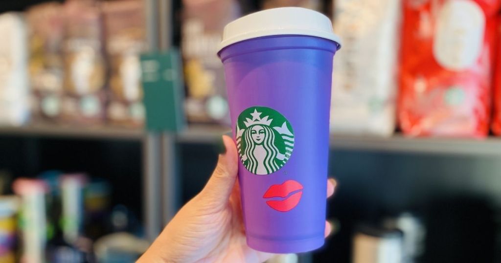 hand holding a Starbucks Reusable Cup
