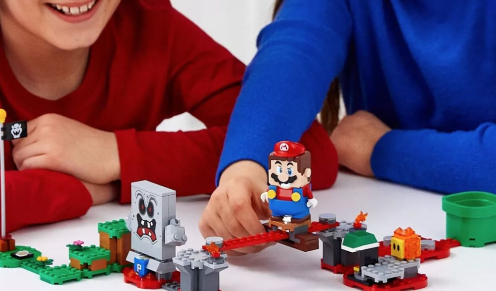 kids playing with Super Mario LEGOs