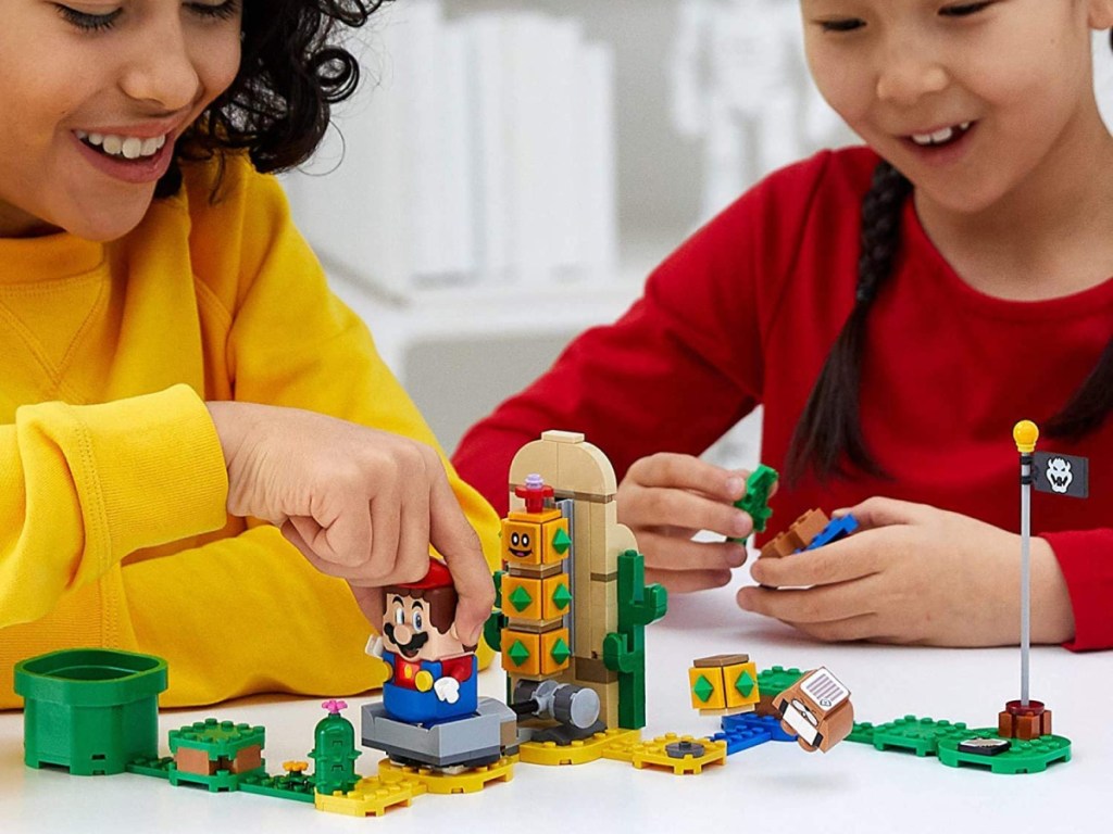 kids playing with legos at table