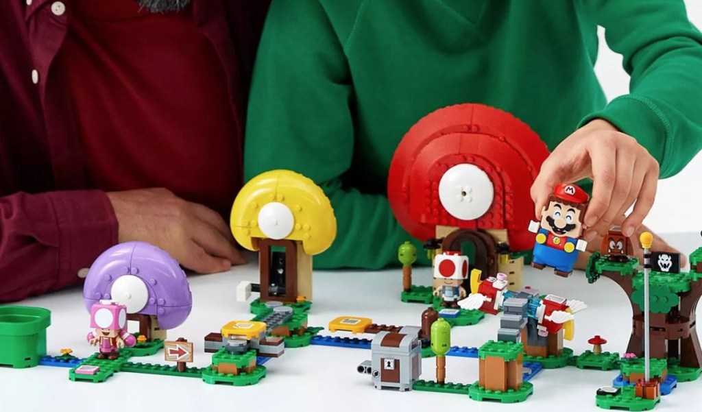 people playing with LEGO set