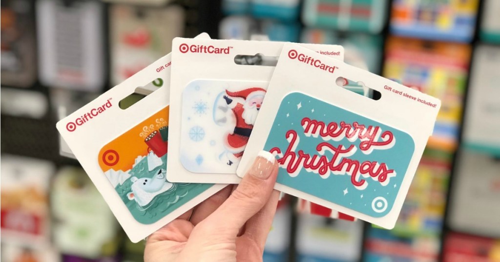 Woman's hand holding Target Holiday Gift Cards