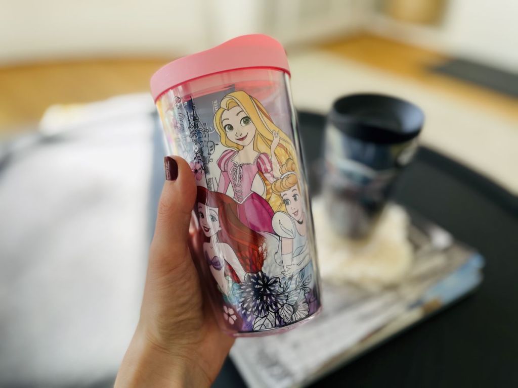 hand holding a Tervis tumbler