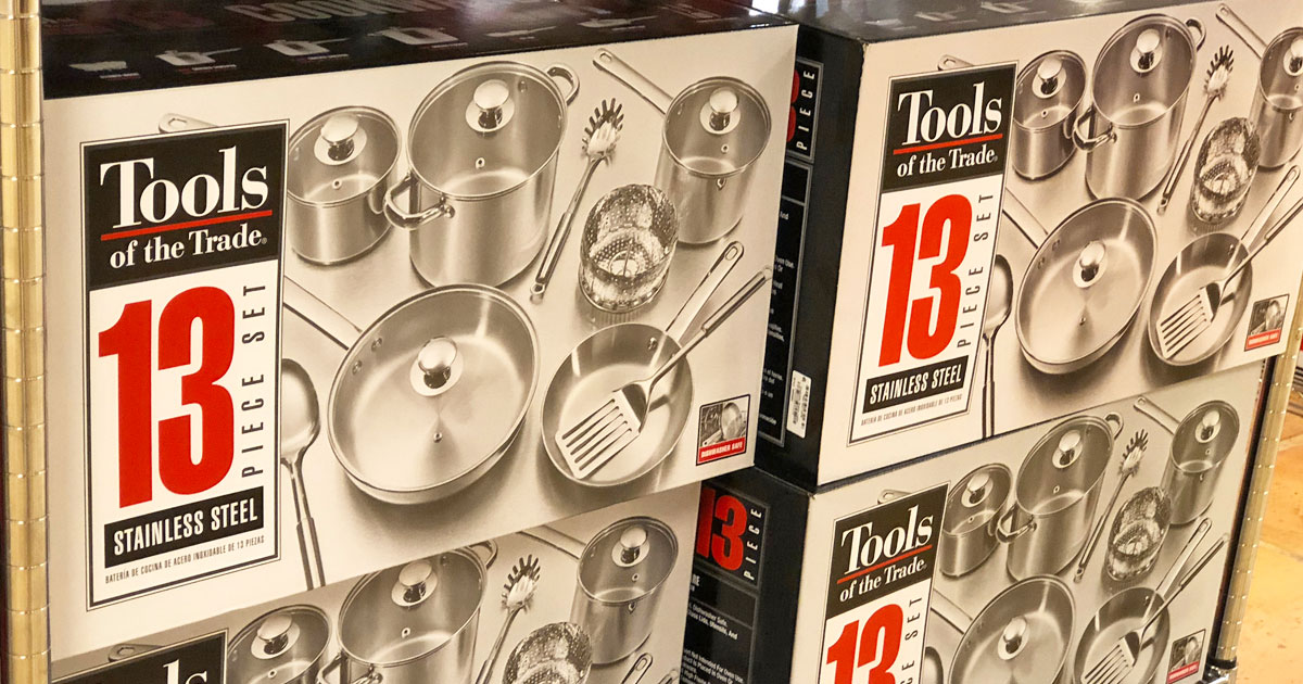 tools of the trade stainless steel cookware set boxes stacked on one another on store display shelf