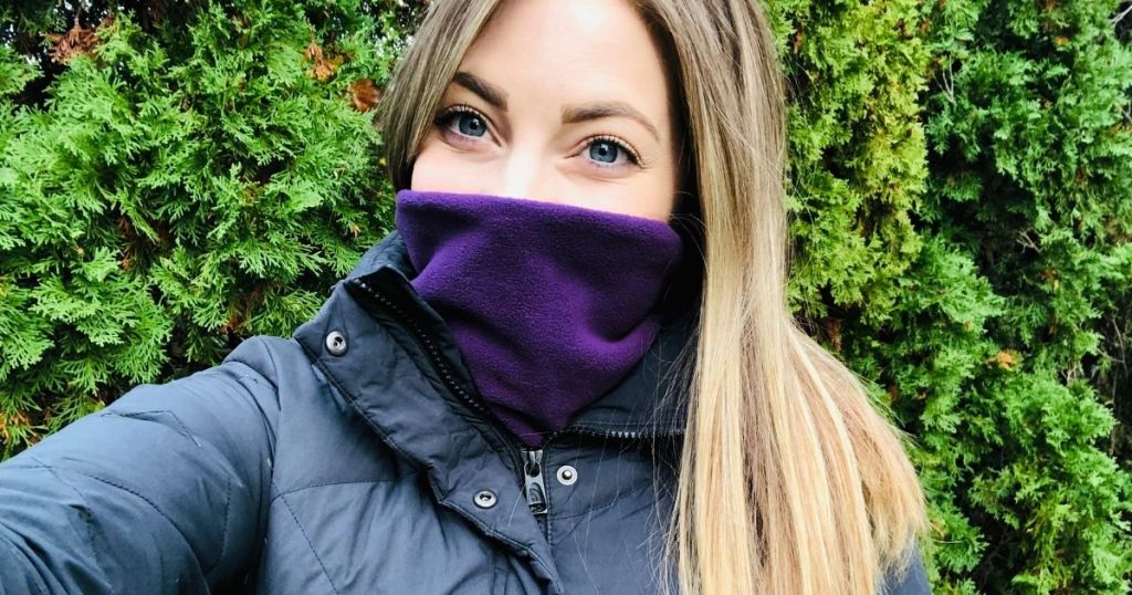 woman with a neck warmer on her face