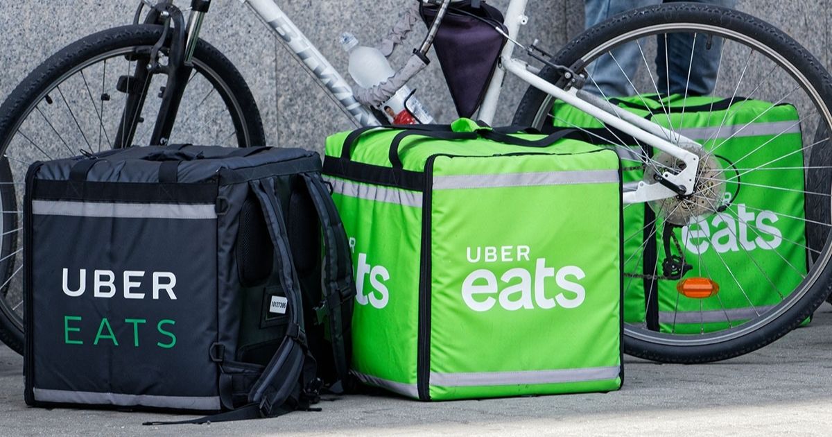 Uber Eats delivery bags by a bike