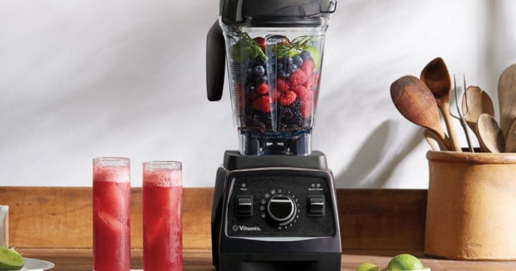 Vitamix E320 with red smoothies on counter