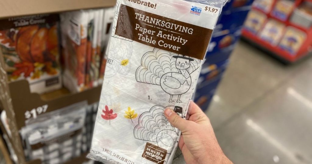 Hand holding Walmart Thanksgiving Color-On Tablecloth