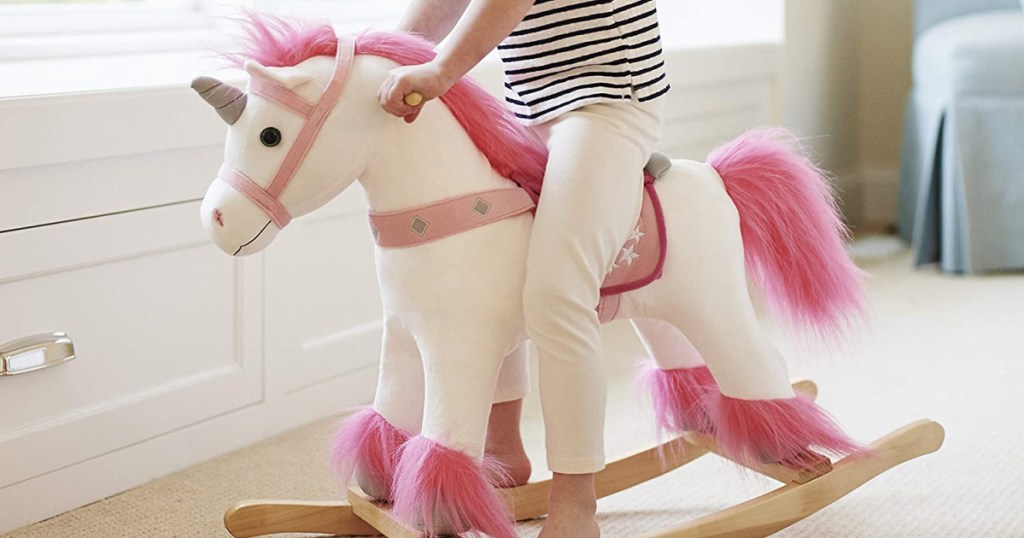 little girl on animal adventure ride-on unicorn