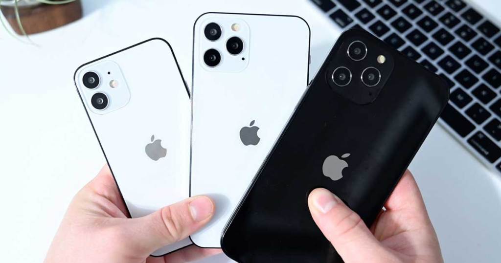 holding 3 Apple iPhones