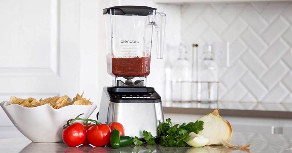 blender on counter with veggies