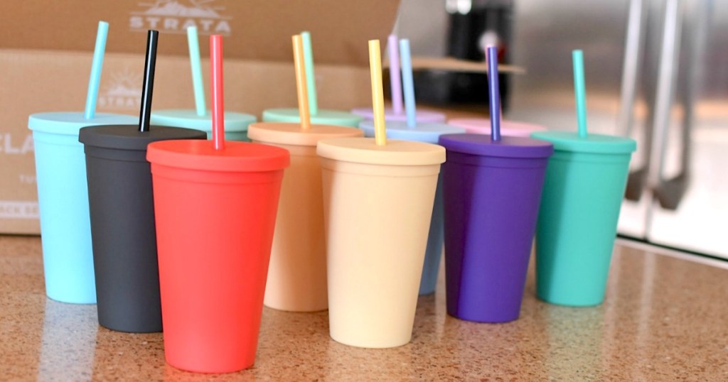 colorful tumblers with straws 