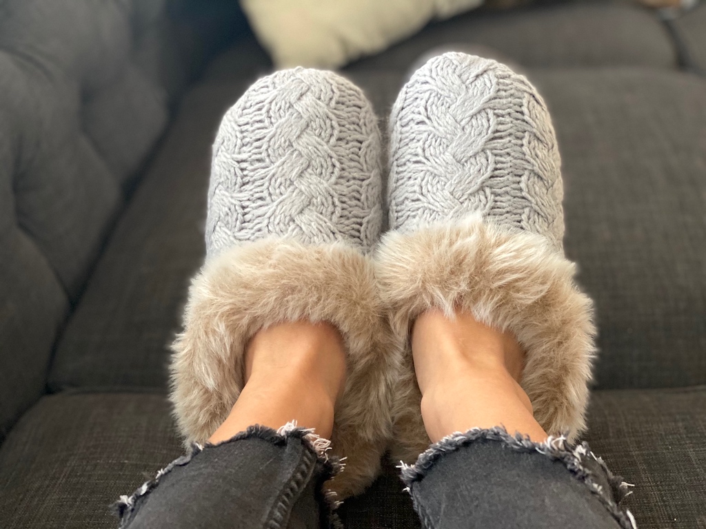 woman wearing cozy dearfoams slippers