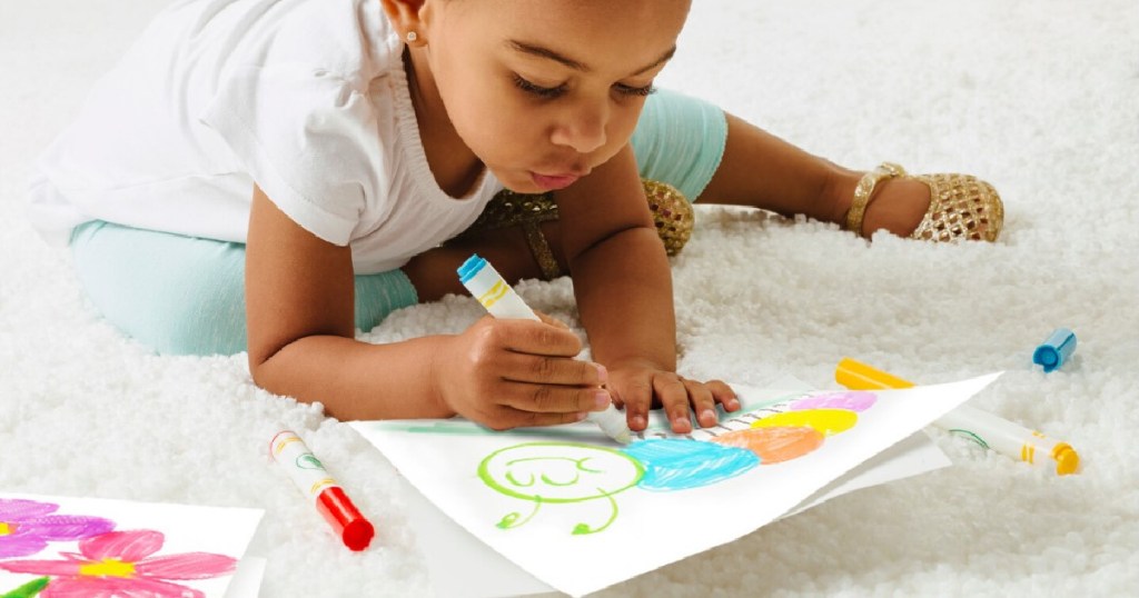 little girl using crayola color wonder 