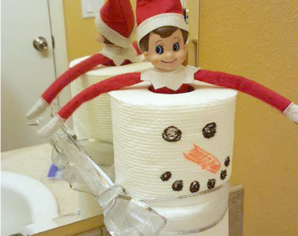 elf in a toilet paper snowman