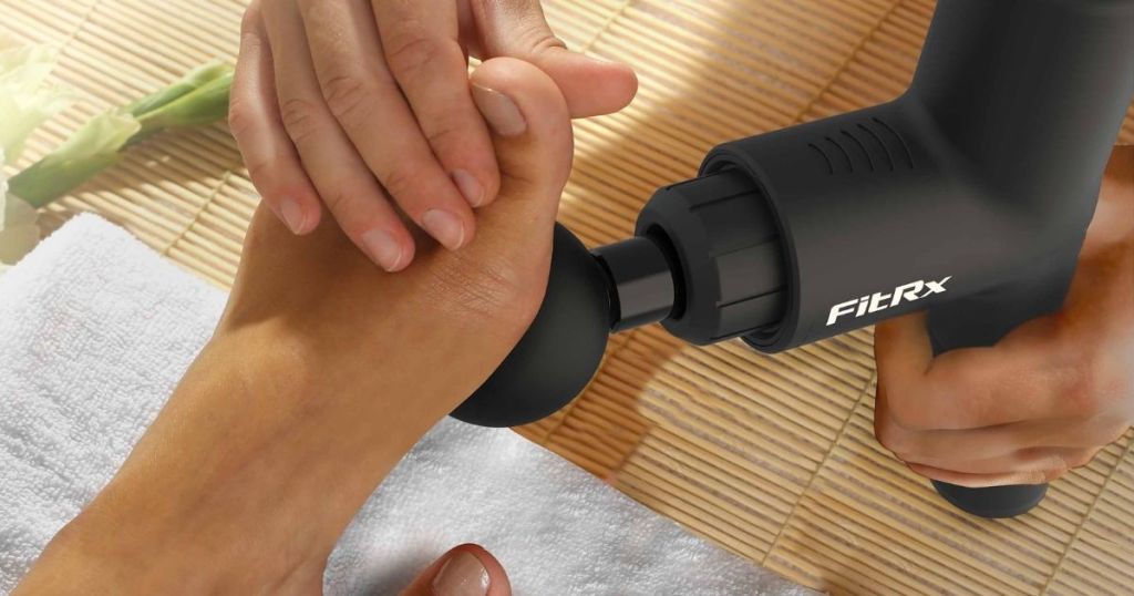 foot getting massaged with black FitRx massager